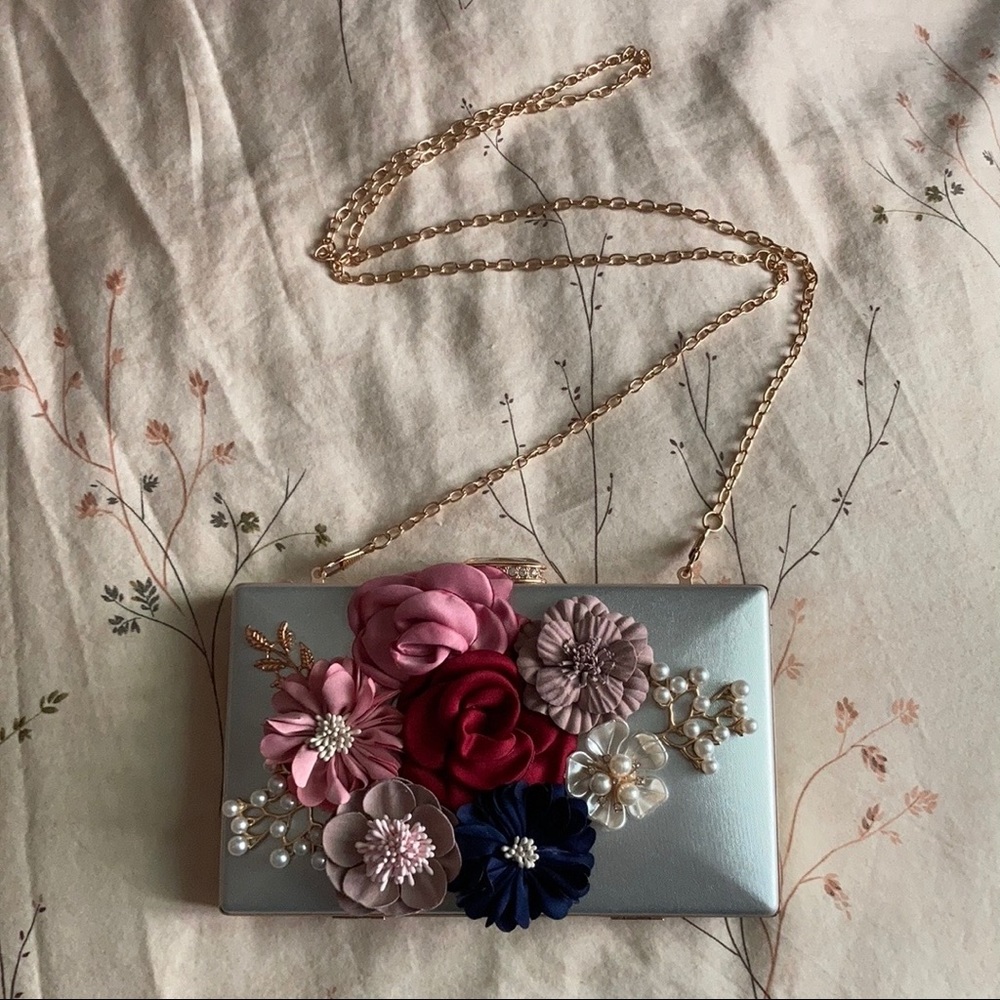 Silver floral clutch with gold accents
